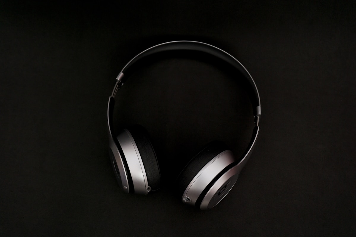 Budget gaming headsets arranged on dark desk with RGB lighting