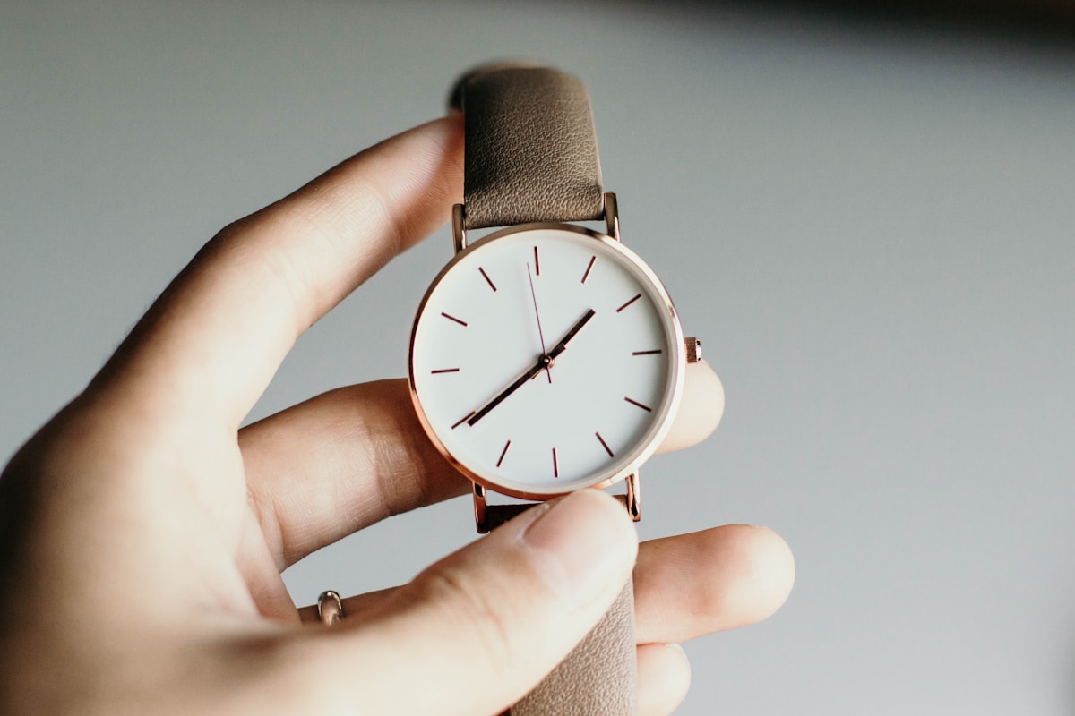 Collection of wristwatches on marble surface